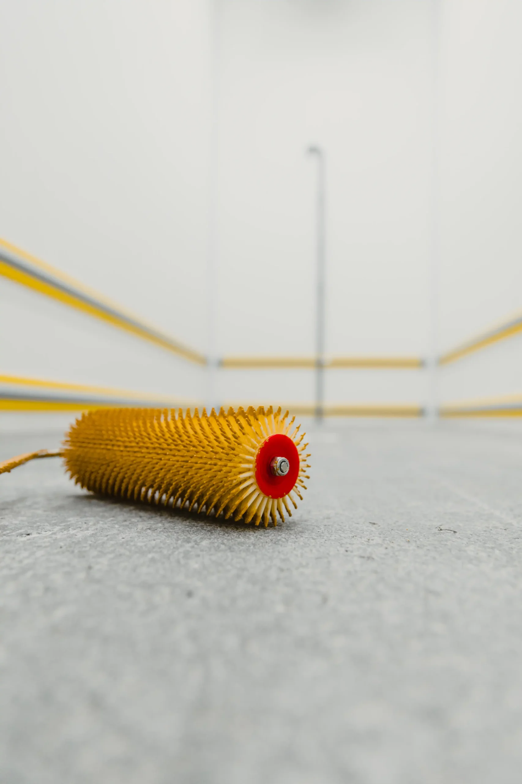 spiked-roller-tool-on-gray-surface-in-room-2026-03-18-12-02-41-utc